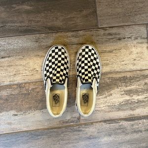 Checkered slip-on vans